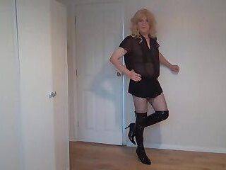 Blonde in black latex boots and fishnets - ashemaletube.com
